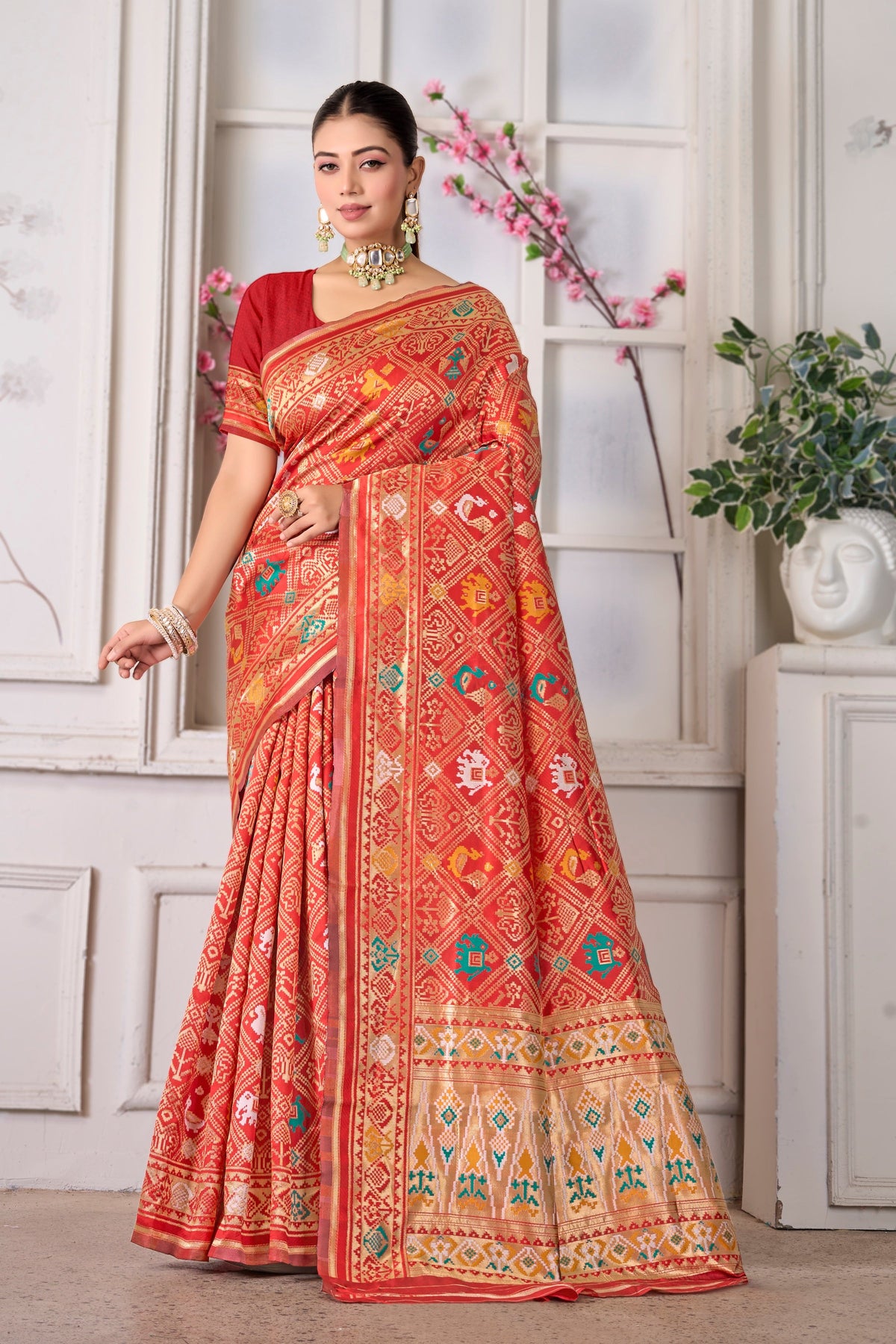 A bright red Patola saree with gold border