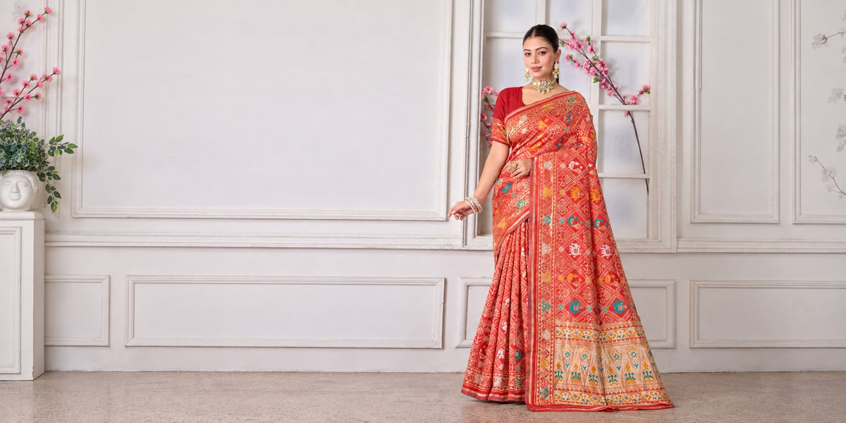 Model in the red silk woven Patola saree