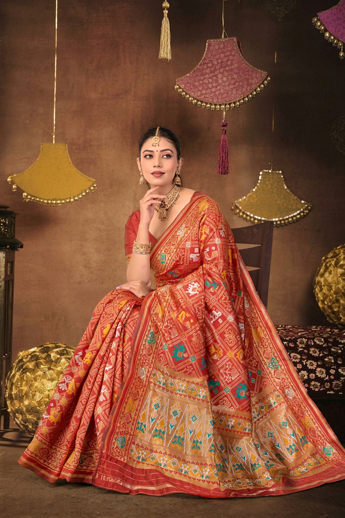 Red Silk Woven Patola Saree — seated drape