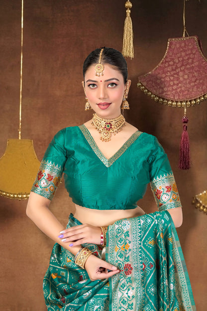 Turquoise Silk Woven Patola Saree — blouse and border, close-up